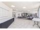 Expansive common area with tables, chairs, and natural light, perfect for community events or relaxation at 1 Oceans West Blvd # 1B2, Daytona Beach, FL 32118
