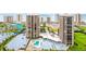 Extensive view of the resort, including a large swimming pool area and high-rise condos on the coastline at 1 Oceans West Blvd # 1B2, Daytona Beach, FL 32118