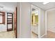 Hallway leading to a bathroom and closet with ample storage space at 1 Oceans West Blvd # 1B2, Daytona Beach, FL 32118