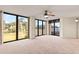 Bright living room with large windows providing natural light and beautiful views of the outdoors at 1 Oceans West Blvd # 1B2, Daytona Beach, FL 32118
