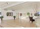 Bright lobby area with tiled floors, potted plants, and a view of the exterior, offering a welcoming atmosphere at 1 Oceans West Blvd # 1B2, Daytona Beach, FL 32118