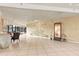Spacious lobby area with tile flooring, palm tree mural, and water feature, offering a welcoming entrance at 1 Oceans West Blvd # 1B2, Daytona Beach, FL 32118
