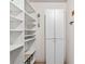 Pantry with white shelving and white cabinets at 1 Oceans West Blvd # 1B2, Daytona Beach, FL 32118