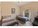 This bedroom features hardwood floors, a window with natural light, and two twin beds at 100 Via Rosa Ct, Debary, FL 32713