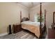 This bedroom features hardwood floors, a window with natural light, and a queen-size bed at 100 Via Rosa Ct, Debary, FL 32713