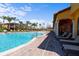 The large community pool has a poolside covered veranda with lounge chairs for relaxing and enjoying the sun at 100 Via Rosa Ct, Debary, FL 32713