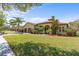 Stunning home with lush landscaping, multi-car garage, and a barrel tile roof, showcasing curb appeal at 100 Via Rosa Ct, Debary, FL 32713
