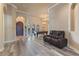 Open-concept living room and game room with wood floors at 100 Via Rosa Ct, Debary, FL 32713