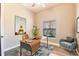 This office features hardwood floors, a window with natural light, a desk, and a chair at 100 Via Rosa Ct, Debary, FL 32713