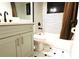 Stylish bathroom with sleek gray vanity, tiled floors and shower with modern fixtures at 1013 Matterhorn St, Deltona, FL 32725