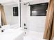 Chic bathroom features a single sink vanity, tiled floors and shower at 1013 Matterhorn St, Deltona, FL 32725