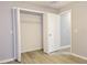 Bedroom with closet, light gray walls, and light vinyl flooring at 1013 Matterhorn St, Deltona, FL 32725