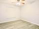 Neutral bedroom with ceiling fan and window letting in natural light at 1013 Matterhorn St, Deltona, FL 32725
