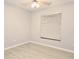 Empty bedroom with a ceiling fan, laminate flooring and large window at 1013 Matterhorn St, Deltona, FL 32725