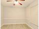 Well lit bedroom with ceiling fan and wood look flooring at 1013 Matterhorn St, Deltona, FL 32725