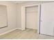 Bedroom with closet, light gray walls, and light vinyl flooring at 1013 Matterhorn St, Deltona, FL 32725