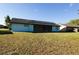 Home exterior with solar panels and enclosed patio in backyard at 1013 Matterhorn St, Deltona, FL 32725