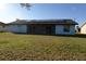 Home exterior with solar panels and enclosed patio in backyard at 1013 Matterhorn St, Deltona, FL 32725