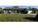 Charming brick home with blue shutters and well-maintained front yard at 1013 Matterhorn St, Deltona, FL 32725