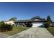 Inviting home with a two-car garage and well-manicured lawn at 1013 Matterhorn St, Deltona, FL 32725