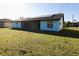 Home exterior with solar panels and enclosed patio in backyard at 1013 Matterhorn St, Deltona, FL 32725