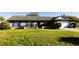 Charming brick home with blue shutters and well-maintained front yard at 1013 Matterhorn St, Deltona, FL 32725