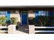 Charming home exterior with a blue front door, brick facade, blue shutters and well-maintained landscaping at 1013 Matterhorn St, Deltona, FL 32725