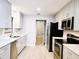 Modern kitchen with stainless steel appliances, quartz counters, and updated cabinets at 1013 Matterhorn St, Deltona, FL 32725