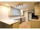 Well-lit kitchen featuring modern appliances, light wood floors, and ample counter space at 1013 Matterhorn St, Deltona, FL 32725