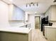 Renovated kitchen boasting quartz countertops, stainless steel appliances, and ample storage at 1013 Matterhorn St, Deltona, FL 32725