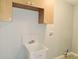 Functional laundry room with cabinet storage and wash basin at 1013 Matterhorn St, Deltona, FL 32725