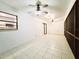 Bright living room boasts tile floors, dual ceiling fans and access to the kitchen and exterior at 1013 Matterhorn St, Deltona, FL 32725