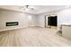 Spacious living room with modern electric fireplace and sliding glass doors to the patio at 1013 Matterhorn St, Deltona, FL 32725