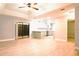 Spacious living area showcases seamless flow into the kitchen and access to outdoor living through sliding glass doors at 1013 Matterhorn St, Deltona, FL 32725