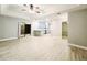 Open-concept living room with modern electric fireplace and breakfast bar at 1013 Matterhorn St, Deltona, FL 32725