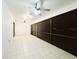 Spacious screened-in patio with white tile flooring and fan at 1013 Matterhorn St, Deltona, FL 32725