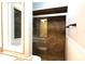 Close-up of a tiled shower featuring glass doors and modern fixtures at 1013 Matterhorn St, Deltona, FL 32725