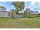 Backyard with a wooden deck, providing an outdoor seating area and space for relaxation and entertainment at 1033 Windbrook Dr, Deltona, FL 32725