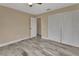 Bedroom with modern wood-look tile flooring and a closet at 1033 Windbrook Dr, Deltona, FL 32725