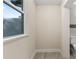 Bathroom area featuring tile floor and a window, with a view to the outside at 1135 Holly Ave, Daytona Beach, FL 32117