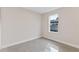 This bedroom features tile flooring and a window for natural light at 1135 Holly Ave, Daytona Beach, FL 32117