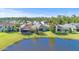 An elevated exterior displays homes nestled by a tranquil lake at 118 Grande Belfly Way, Daytona Beach, FL 32124
