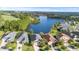 Aerial view of homes nestled near a serene lake and verdant woods at 118 Grande Belfly Way, Daytona Beach, FL 32124
