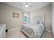 Inviting bedroom with decorative headboard, soft hues, and ample natural light at 118 Grande Belfly Way, Daytona Beach, FL 32124