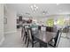 Open-concept dining room with views of the kitchen and living area at 118 Grande Belfly Way, Daytona Beach, FL 32124