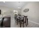 Elegant dining room with a modern chandelier and light plank flooring at 118 Grande Belfly Way, Daytona Beach, FL 32124