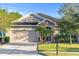 Charming single-story home with a stone-accented entryway and a well-maintained front yard at 118 Grande Belfly Way, Daytona Beach, FL 32124