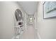 Bright hallway with light gray plank flooring and white trim at 118 Grande Belfly Way, Daytona Beach, FL 32124