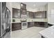 Spacious kitchen featuring stainless appliances, ample cabinet space, and light wood flooring at 118 Grande Belfly Way, Daytona Beach, FL 32124