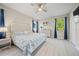 Serene main bedroom with a decorative headboard, blue accents, and ample natural light at 118 Grande Belfly Way, Daytona Beach, FL 32124